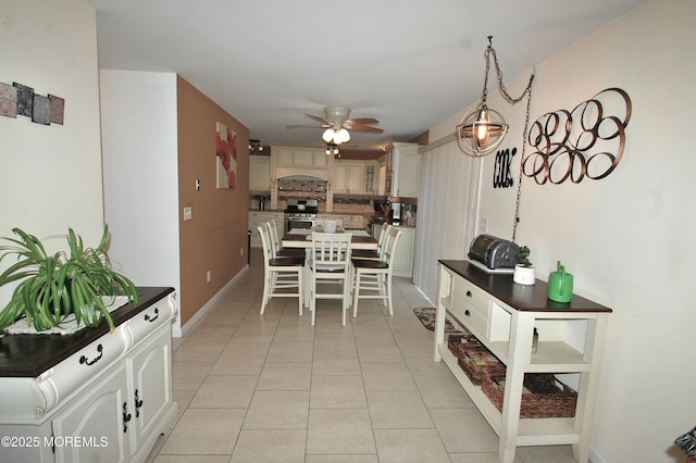 711 Edmunds Ave, Union Beach, NJ 07735 - dining area featuring light tile patterned floors, baseboards, and ceiling fan