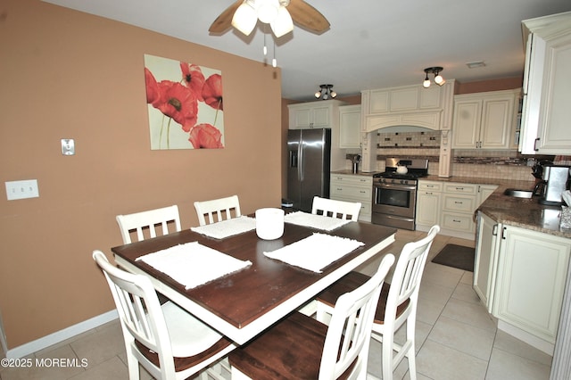 711 Edmunds Ave, Union Beach, NJ 07735 - dining room featuring baseboards, a ceiling fan, light tile patterned flooring, and visible vents