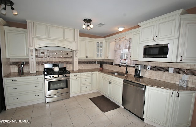711 Edmunds Ave, Union Beach, NJ 07735 - kitchen featuring visible vents, a sink, tasteful backsplash, and stainless steel appliances