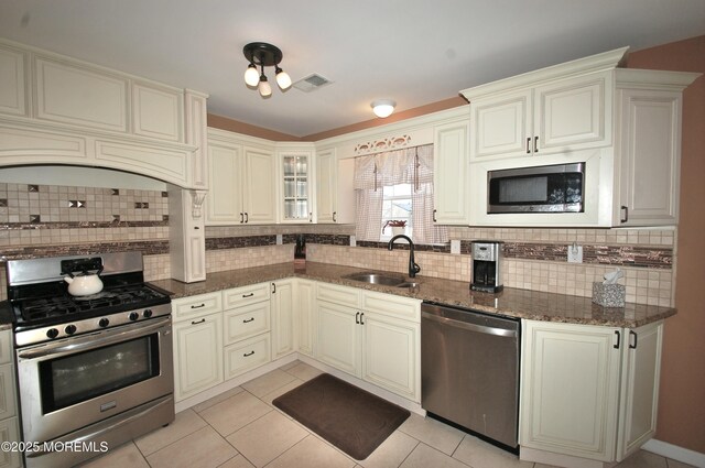 711 Edmunds Ave, Union Beach, NJ 07735 - kitchen featuring visible vents, a sink, tasteful backsplash, and stainless steel appliances