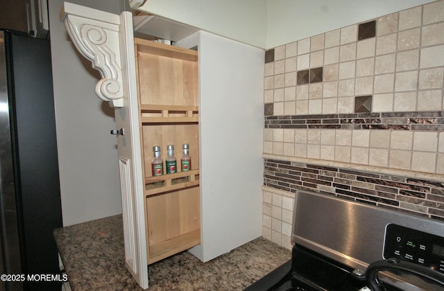 711 Edmunds Ave, Union Beach, NJ 07735 - interior space with freestanding refrigerator, stove, and tasteful backsplash