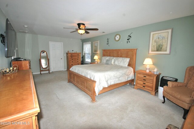 711 Edmunds Ave, Union Beach, NJ 07735 - bedroom with a ceiling fan, baseboards, and light colored carpet