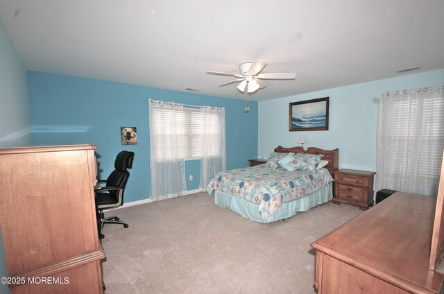 711 Edmunds Ave, Union Beach, NJ 07735 - carpeted bedroom featuring baseboards, a ceiling fan, and visible vents