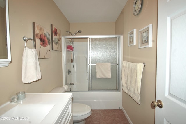 711 Edmunds Ave, Union Beach, NJ 07735 - bathroom featuring tile patterned flooring, combined bath / shower with glass door, toilet, and vanity