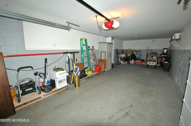 711 Edmunds Ave, Union Beach, NJ 07735 - garage with concrete block wall and a garage door opener