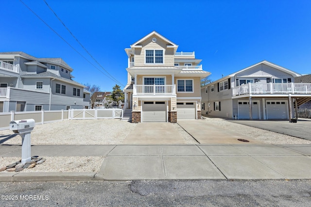305 W 18th St, Ship Bottom, NJ 08008 - view of front facade featuring stone siding, an attached garage, a standing seam roof, driveway, and metal roof
