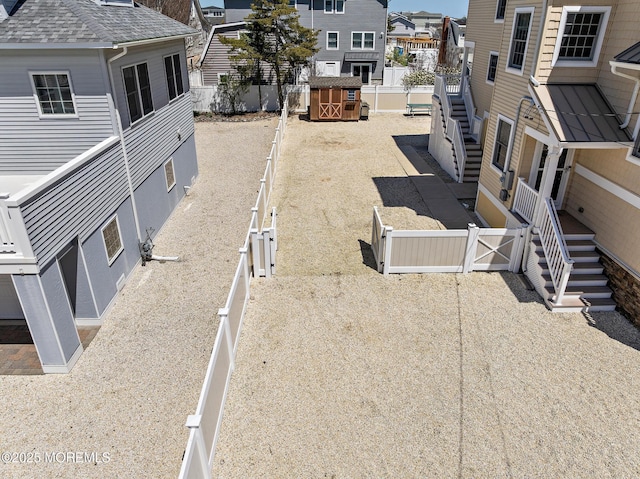 305 W 18th St, Ship Bottom, NJ 08008 - fenced backyard featuring a residential view and stairway