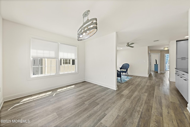 305 W 18th St, Ship Bottom, NJ 08008 - unfurnished living room featuring wood finished floors, baseboards, and a ceiling fan