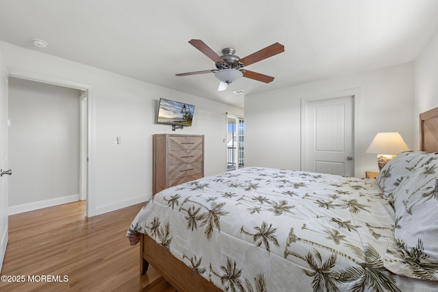 305 W 18th St, Ship Bottom, NJ 08008 - bedroom featuring wood finished floors, baseboards, and a ceiling fan