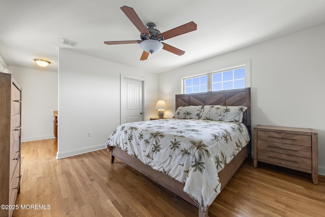 305 W 18th St, Ship Bottom, NJ 08008 - bedroom with light wood finished floors, baseboards, ceiling fan, and a closet