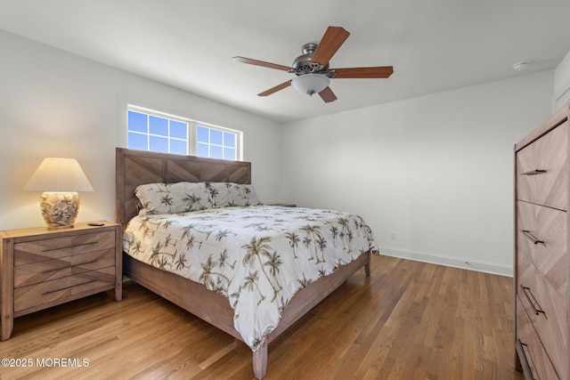 305 W 18th St, Ship Bottom, NJ 08008 - bedroom featuring wood finished floors, baseboards, and a ceiling fan