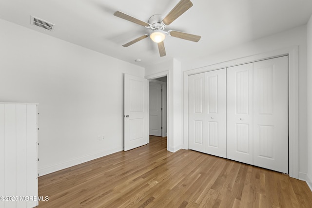 305 W 18th St, Ship Bottom, NJ 08008 - unfurnished bedroom featuring light wood-style floors, baseboards, a closet, and a ceiling fan
