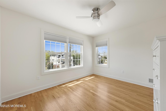 305 W 18th St, Ship Bottom, NJ 08008 - spare room with light wood-style flooring, ceiling fan, and baseboards