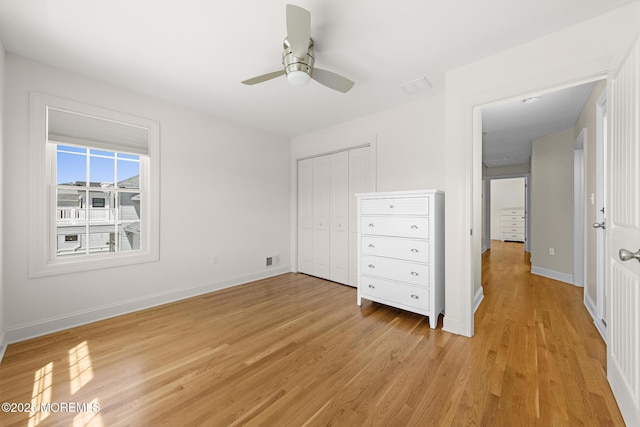 305 W 18th St, Ship Bottom, NJ 08008 - unfurnished bedroom with light wood-style flooring, baseboards, a closet, and a ceiling fan