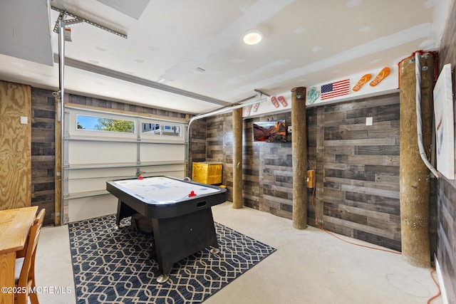 305 W 18th St, Ship Bottom, NJ 08008 - playroom featuring wooden walls, concrete flooring, and a garage