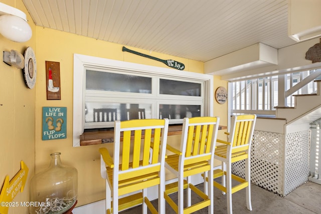 305 W 18th St, Ship Bottom, NJ 08008 - dining area featuring concrete floors and stairs