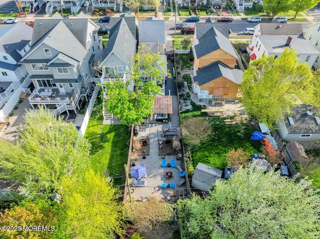 birds eye view of property with a residential view