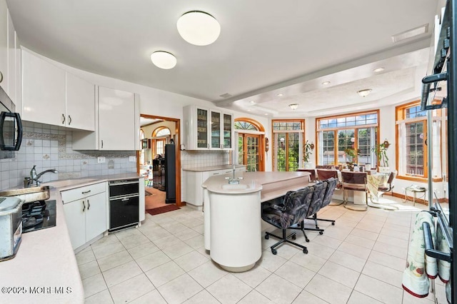 8 Tiberon Dr, Holmdel, NJ 07733 - kitchen featuring light countertops, white cabinets, and decorative backsplash