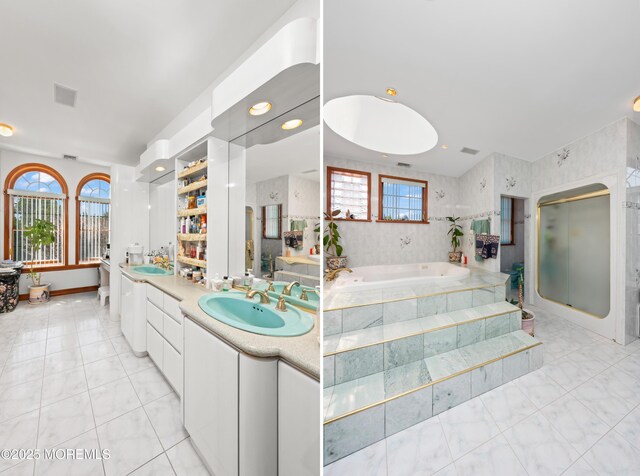 8 Tiberon Dr, Holmdel, NJ 07733 - interior space with a bath, a healthy amount of sunlight, double vanity, and a sink