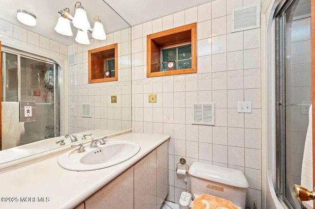 8 Tiberon Dr, Holmdel, NJ 07733 - bathroom featuring vanity, tile walls, toilet, and visible vents
