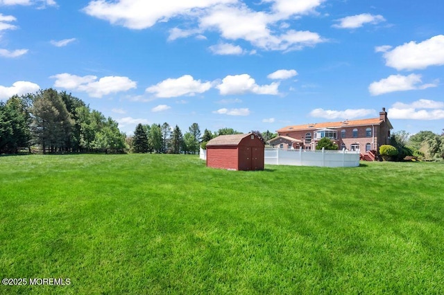 8 Tiberon Dr, Holmdel, NJ 07733 - view of yard featuring an outbuilding, fence, and a storage unit