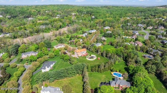 8 Tiberon Dr, Holmdel, NJ 07733 - birds eye view of property featuring a wooded view
