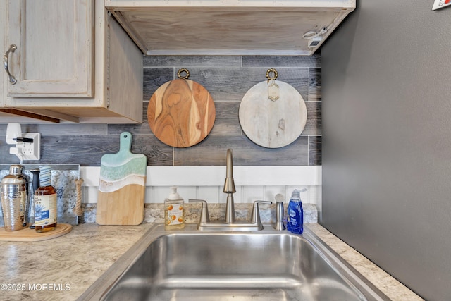 details featuring light countertops and a sink