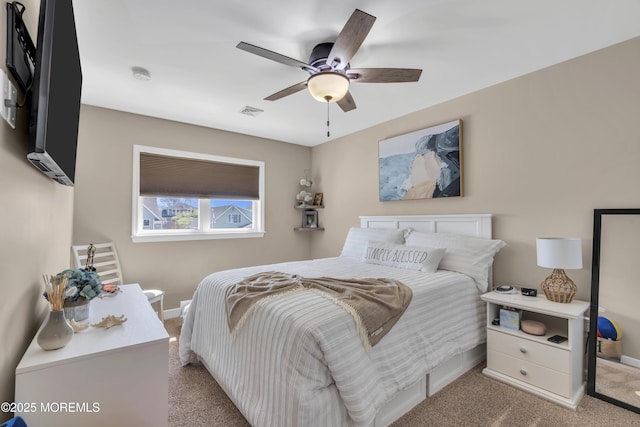 bedroom featuring baseboards, ceiling fan, carpet flooring, and visible vents