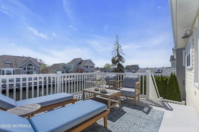 view of patio featuring a residential view and a balcony