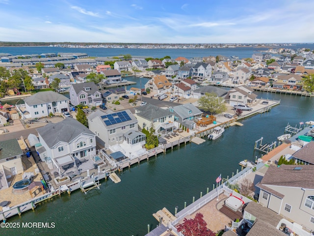 birds eye view of property featuring a residential view and a water view