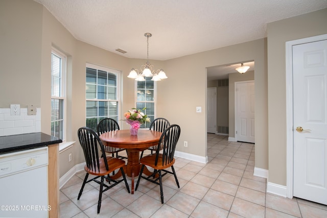 97 Gimbel Pl Unit 1903, Ocean Twp, NJ 07712 - dining room featuring a chandelier, light tile patterned floors, a textured ceiling, and baseboards
