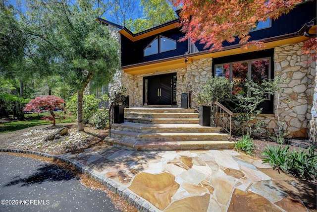 15 Evan Dr, Morganville, NJ 07751 - entrance to property with stone siding