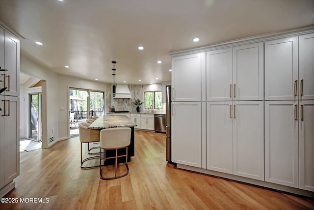 15 Evan Dr, Morganville, NJ 07751 - kitchen with custom exhaust hood, dishwasher, a kitchen island, recessed lighting, and light wood-style flooring