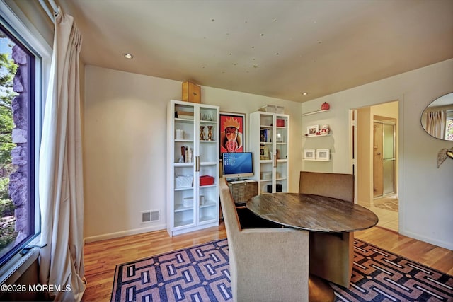 15 Evan Dr, Morganville, NJ 07751 - dining room featuring plenty of natural light, wood finished floors, and baseboards