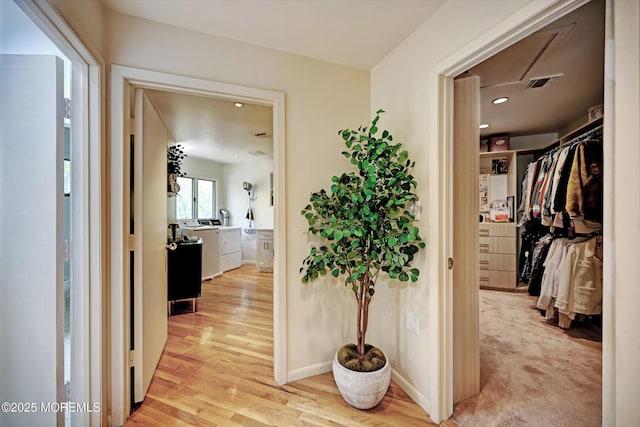 15 Evan Dr, Morganville, NJ 07751 - corridor with washer and dryer, light wood-style flooring, and recessed lighting