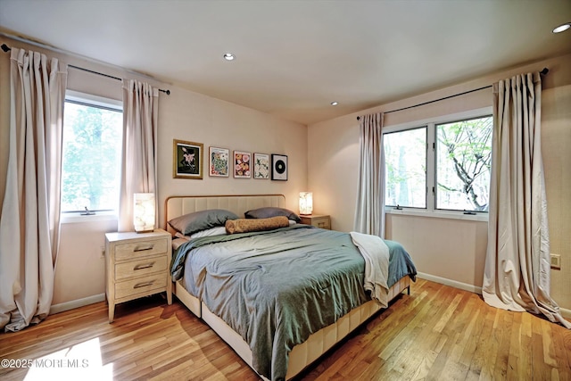 15 Evan Dr, Morganville, NJ 07751 - bedroom with multiple windows, light wood-style flooring, baseboards, and recessed lighting