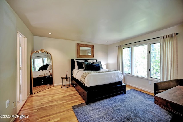 15 Evan Dr, Morganville, NJ 07751 - bedroom featuring light wood-style flooring, multiple windows, and baseboards