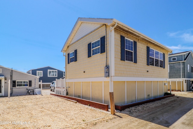 view of property exterior featuring central AC
