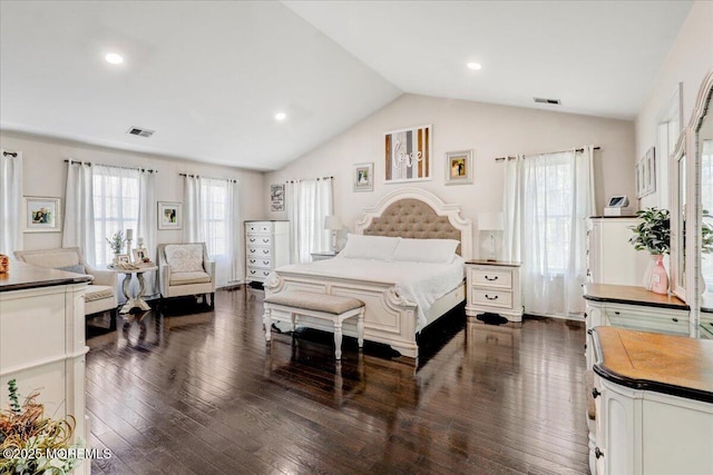 bedroom with visible vents, dark wood finished floors, and vaulted ceiling