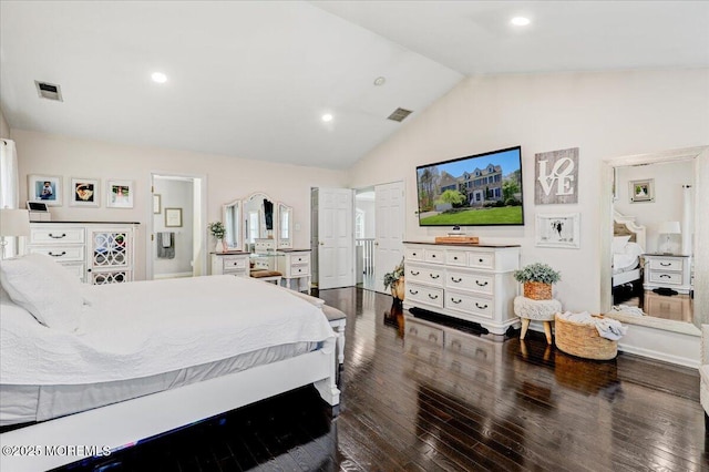bedroom with visible vents, dark wood-style floors, and vaulted ceiling