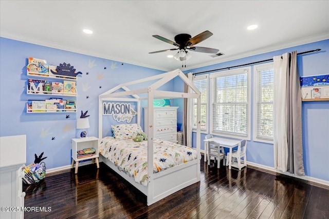bedroom featuring crown molding, baseboards, wood-type flooring, and visible vents