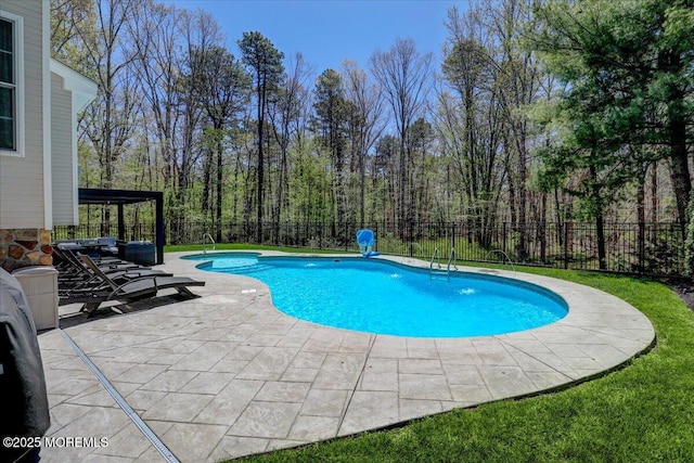 view of swimming pool with a fenced in pool, a fenced backyard, and a patio area