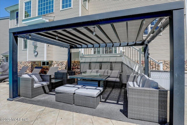 view of patio / terrace with a pergola and an outdoor living space