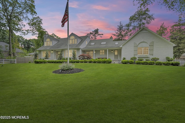1570 Beaver Hollow Dr, Toms River, NJ 08755 - view of front of home featuring fence, a chimney, and a front yard