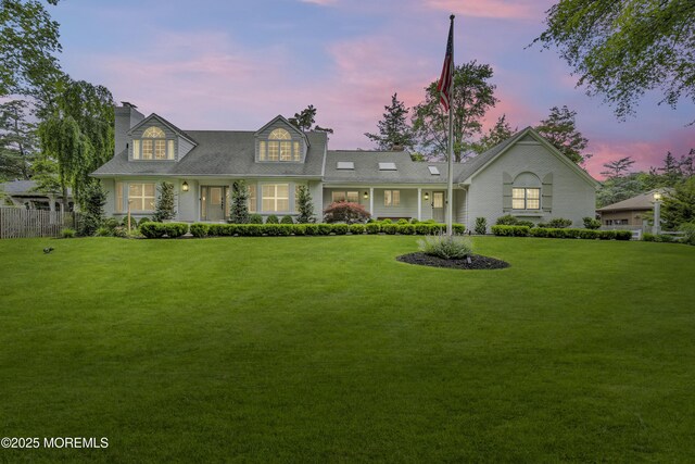 1570 Beaver Hollow Dr, Toms River, NJ 08755 - view of front of property with a lawn, fence, and a chimney