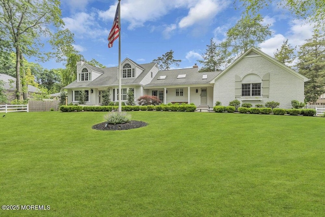 1570 Beaver Hollow Dr, Toms River, NJ 08755 - cape cod home featuring a chimney, fence, and a front yard