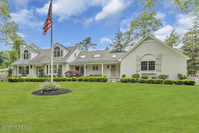 1570 Beaver Hollow Dr, Toms River, NJ 08755 - view of front of house with a front yard and a chimney