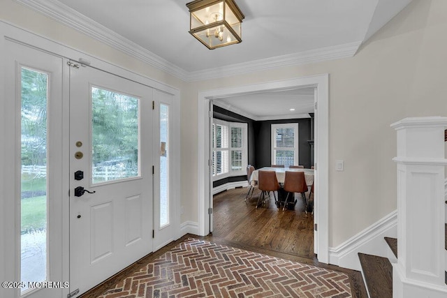 1570 Beaver Hollow Dr, Toms River, NJ 08755 - entrance foyer featuring crown molding, an inviting chandelier, a wealth of natural light, and brick floor