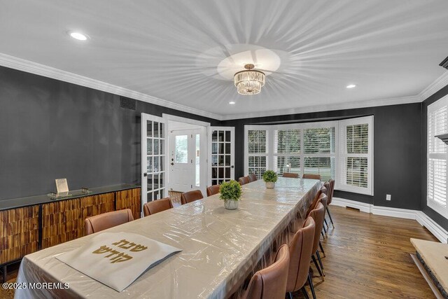 1570 Beaver Hollow Dr, Toms River, NJ 08755 - dining space featuring french doors, wood finished floors, a notable chandelier, ornamental molding, and recessed lighting