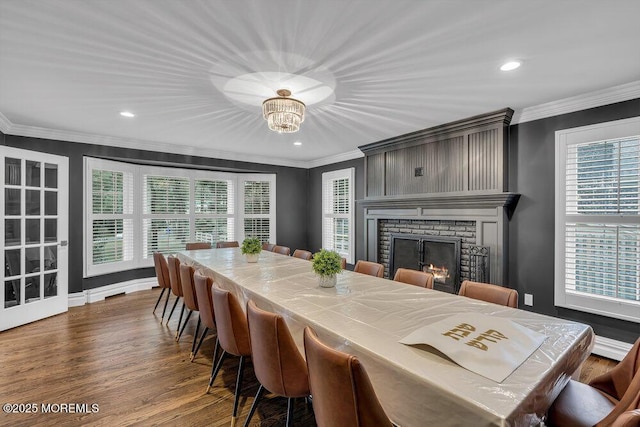 1570 Beaver Hollow Dr, Toms River, NJ 08755 - dining area featuring crown molding, recessed lighting, a brick fireplace, and dark wood-type flooring